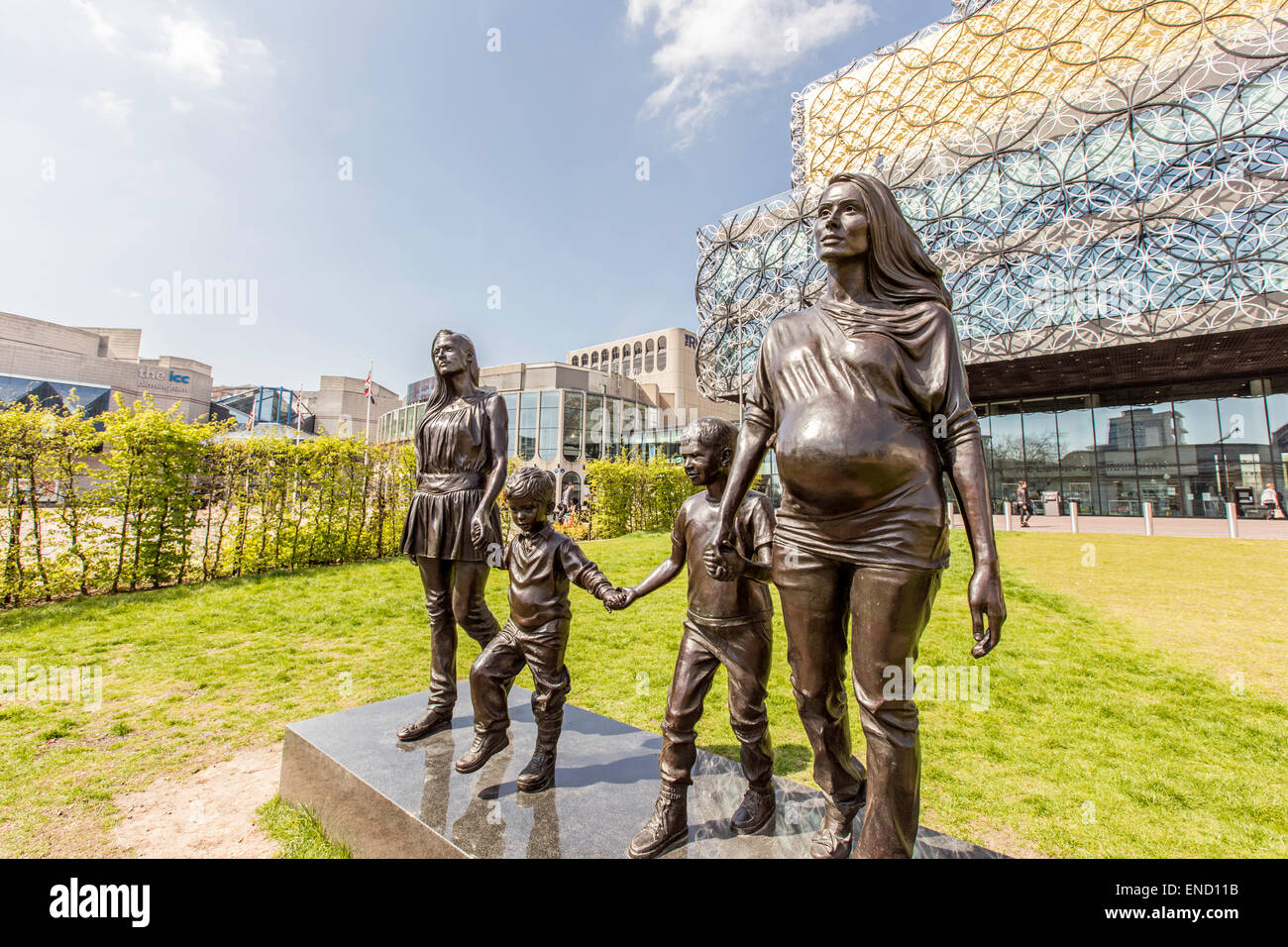 A statue depicting sisters Roma and Emma Jones and their children by Gillian Wearing outside Birmingham Library  England, UK Stock Photo