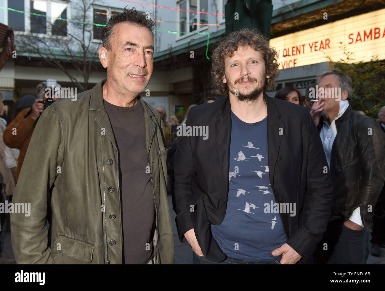 Austrian singer and musician Hubert von Goisern and film director and screenplay writer Marcus H. Rosenmueller (R) arrive for the premiere of the film 'Hubert von Goisern - Brenna tuat's schon lang' (lit. Hubert von Goisern - It's been burning for a long time already) in Munich, Germany 14 April 2015. Photo: Felix Hoerhager/dpa Stock Photo