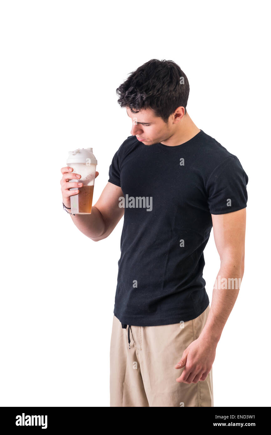 Attractive young man holding protein shake bottle Stock Photo