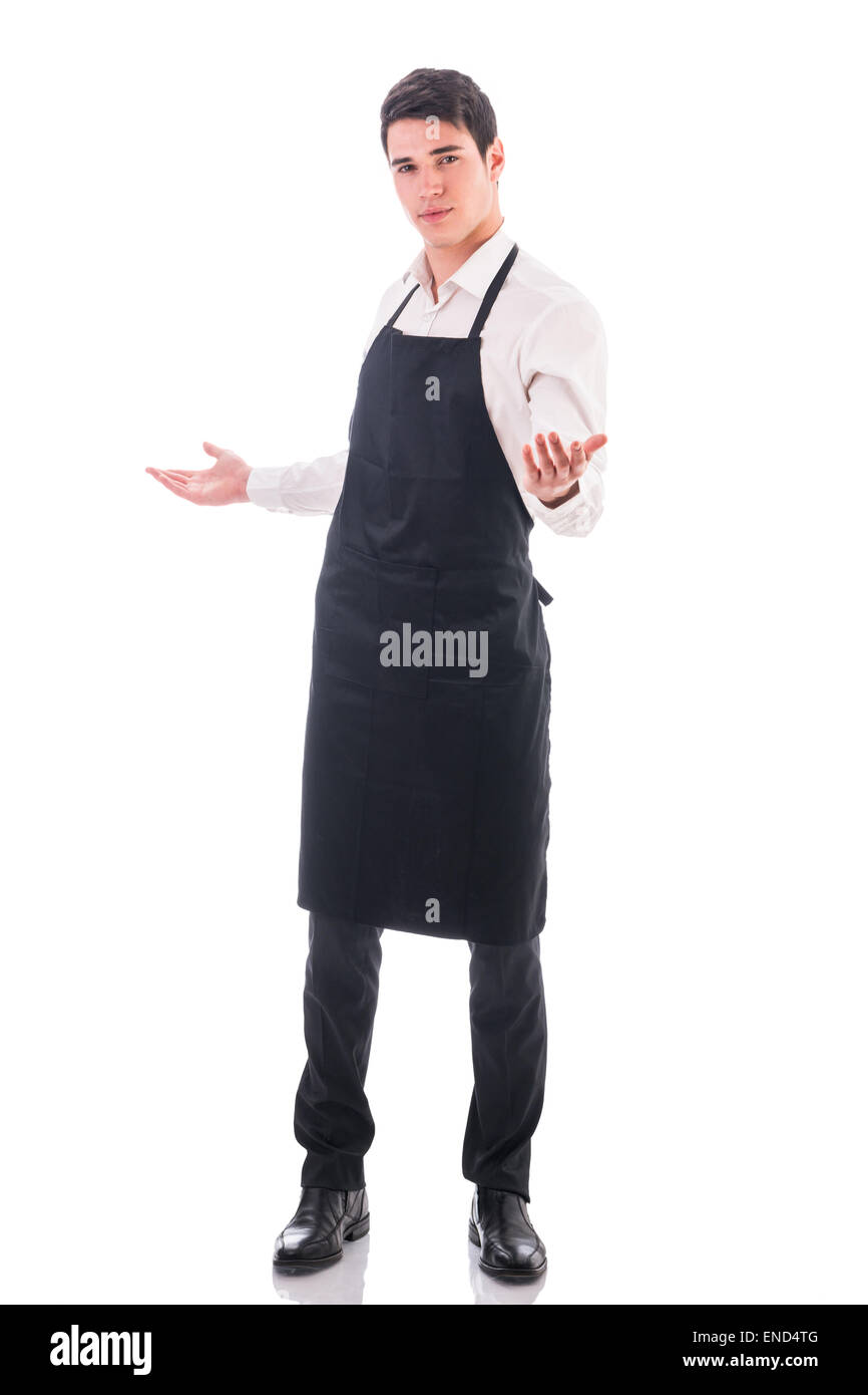 Young chef or waiter wearing black apron isolated Stock Photo