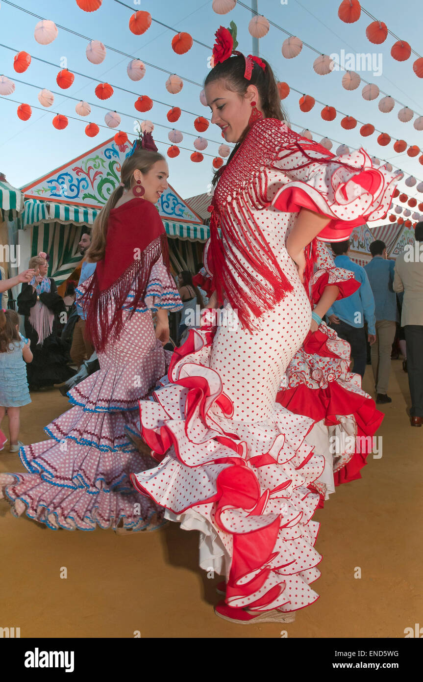 April Fair, Young women dancing with the traditional flamenco dress, Seville, Region of Andalusia, Spain, Europe Stock Photo