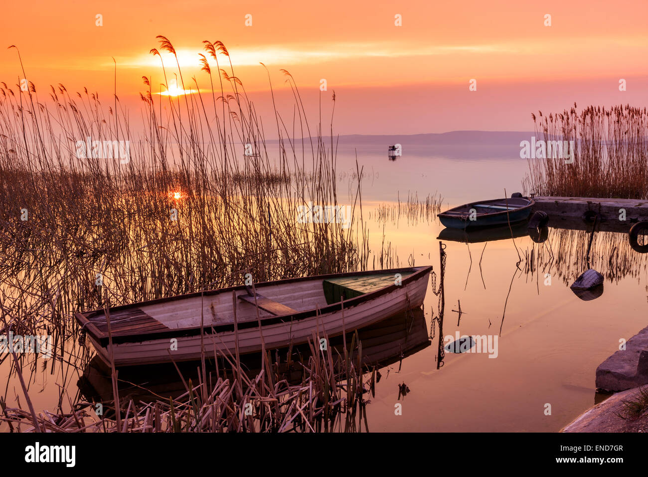 Sunset on the lake Balaton with a boat  in Hungary Stock Photo