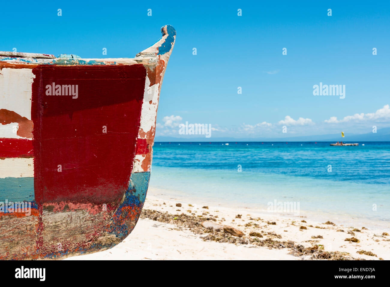 Bough of a wooden fishing boat with the azure ocean in the background Stock Photo