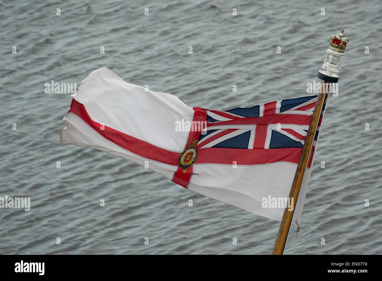 The White Ensign or the St George's Ensign flag flying from the Royal Yacht Britannia, Ocean Quay, Edinburgh, Scotland, UK Stock Photo