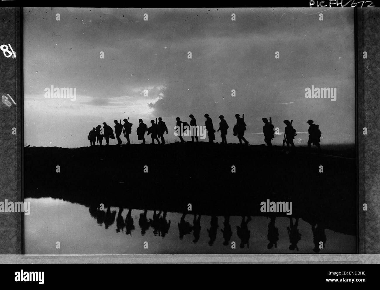 Infantry Moving Forward To Take Up Front Line Positions At Stock Photo