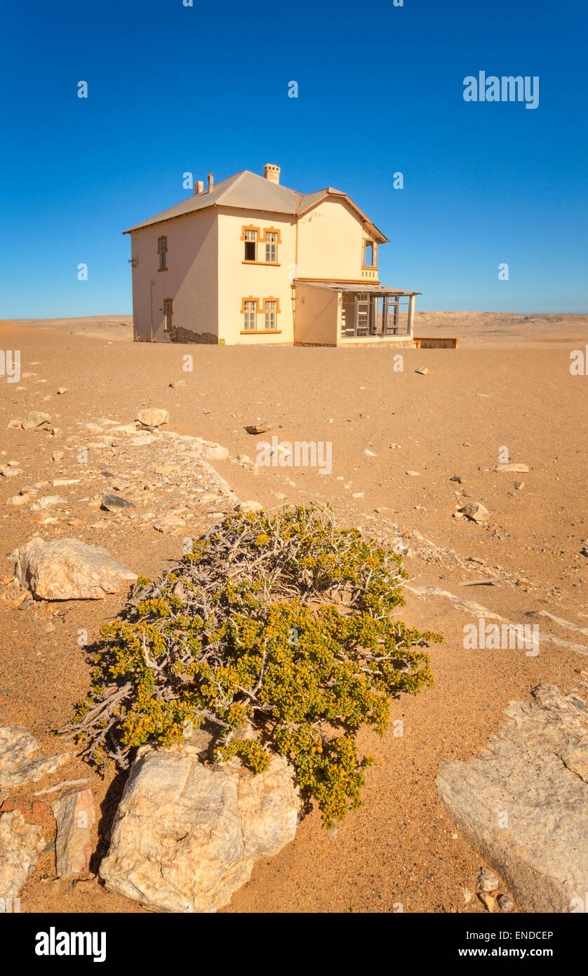 A deserted house in Kolmanskop, a former diamond town in Namibia. Stock Photo