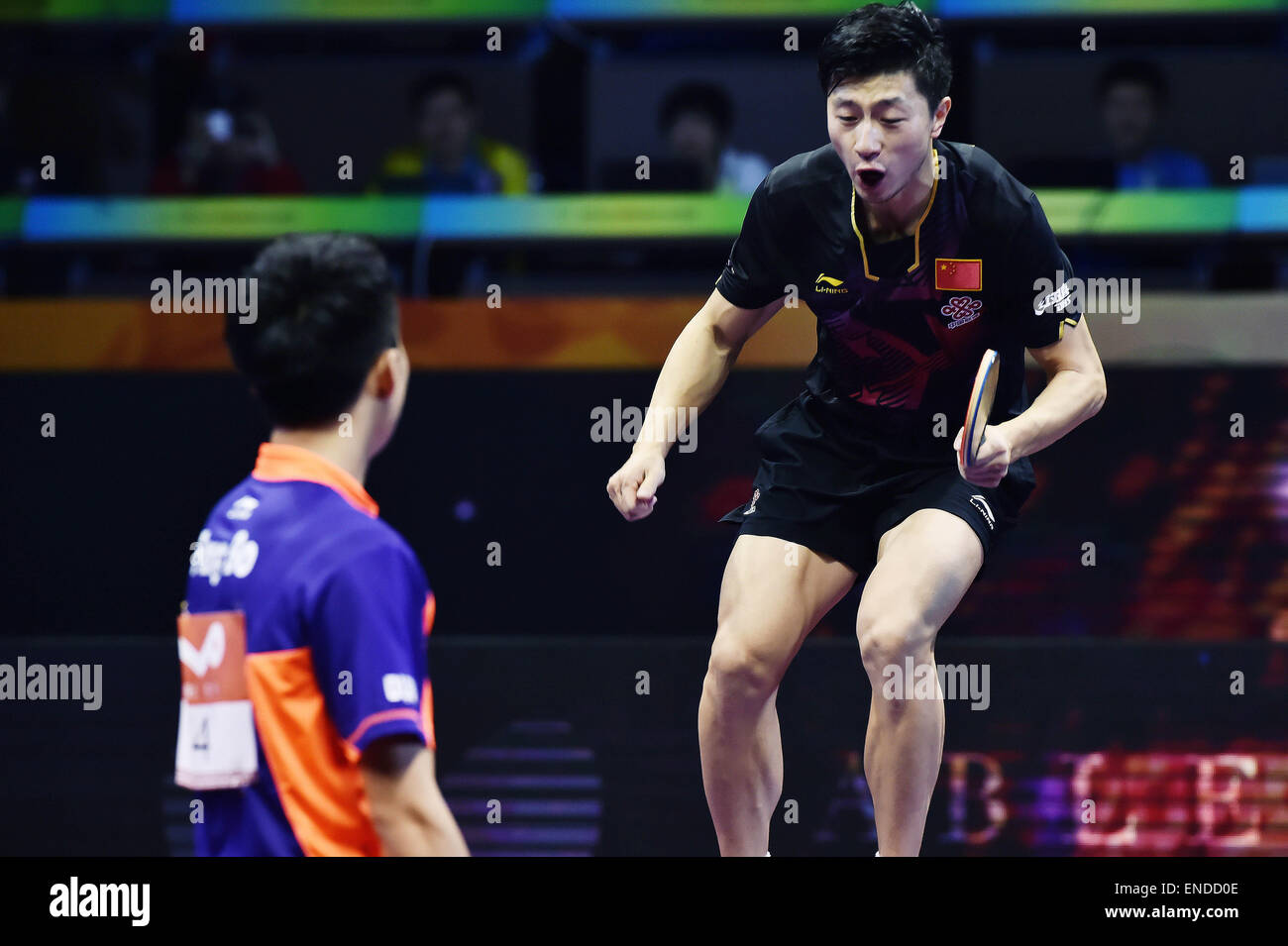 Suzhou, China's Jiangsu Province. 3rd May, 2015. China's Ma Long jumps onto the table to celebrate the victory after Men's Singles Final against his compatriot Fang Bo at the 53rd Table Tennis World Championships in Suzhou, city of east China's Jiangsu Province, on May 3, 2015. Ma Long won 4-2 and claimed the title. Credit:  Han Yuqing/Xinhua/Alamy Live News Stock Photo