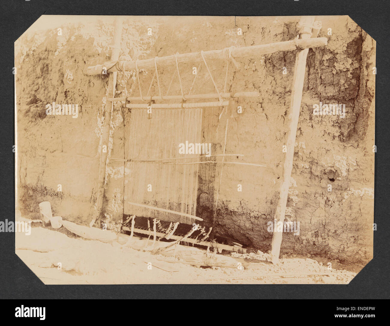 This image shows looms in the process of weaving, an essential element ...