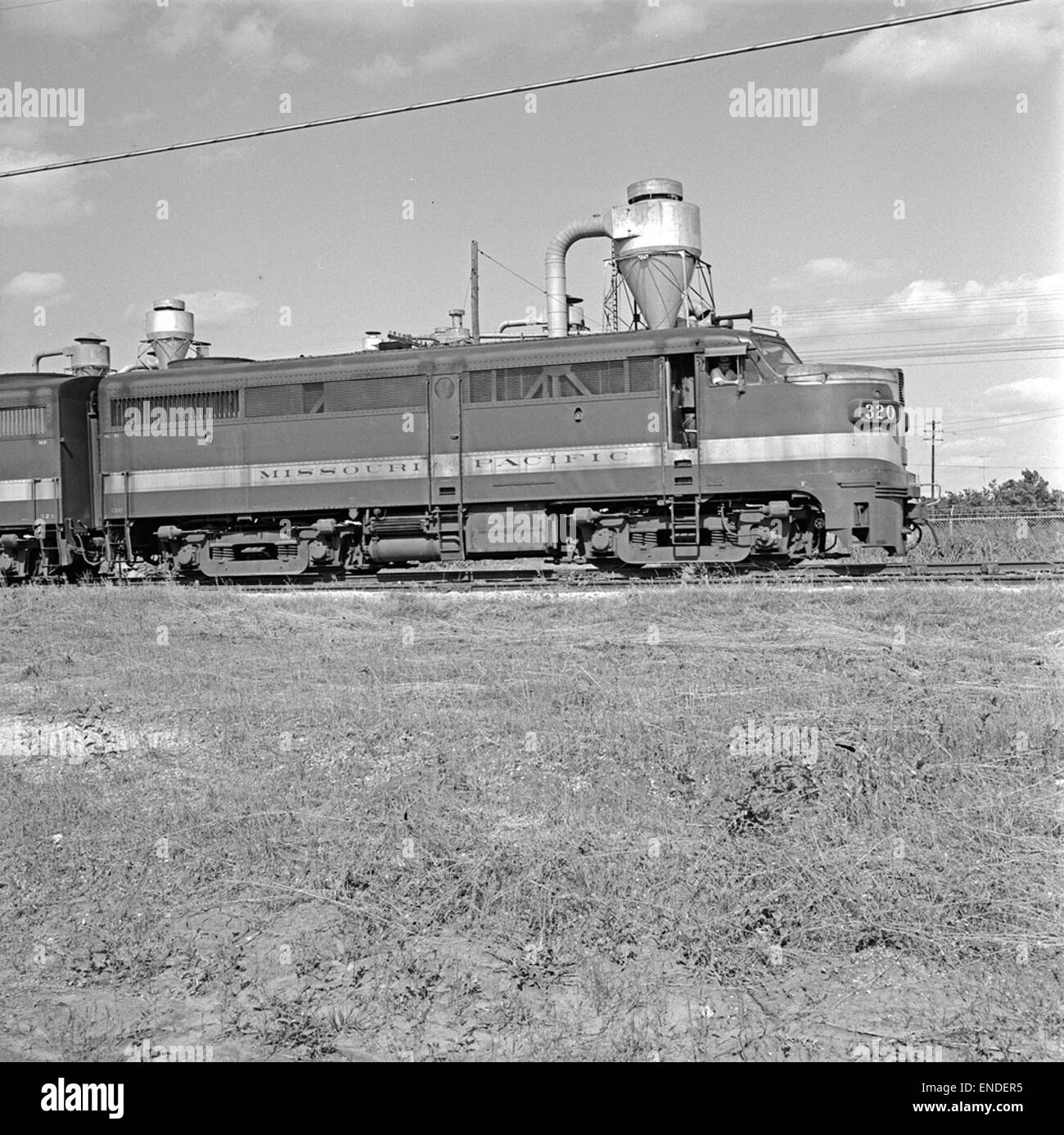 A photograph of Missouri Pacific Railroad's diesel electric freight locomotive No. 320, showcasing the technological advances in early 20th-century railway transportation. Stock Photo
