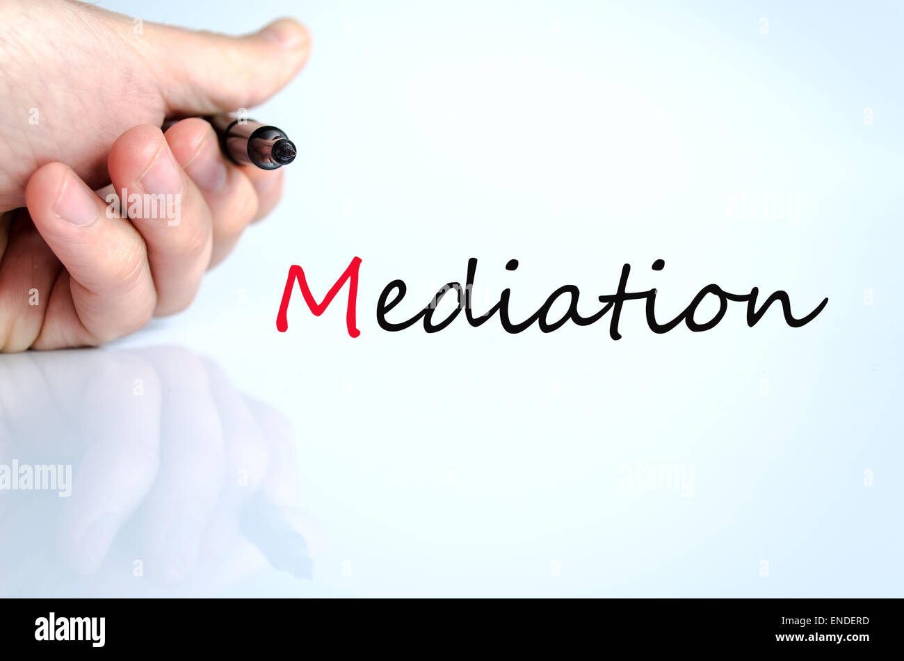 Pen in the hand isolated over white background mediation concept Stock Photo