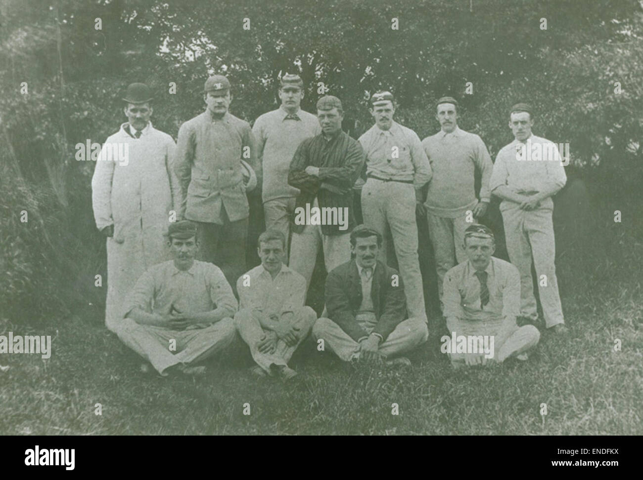 A historical photograph of the Elswick Works cricket team from Newcastle upon Tyne. The image captures the team in their cricket attire, posing for a group photo at their workplace in the late 19th or early 20th century. Stock Photo