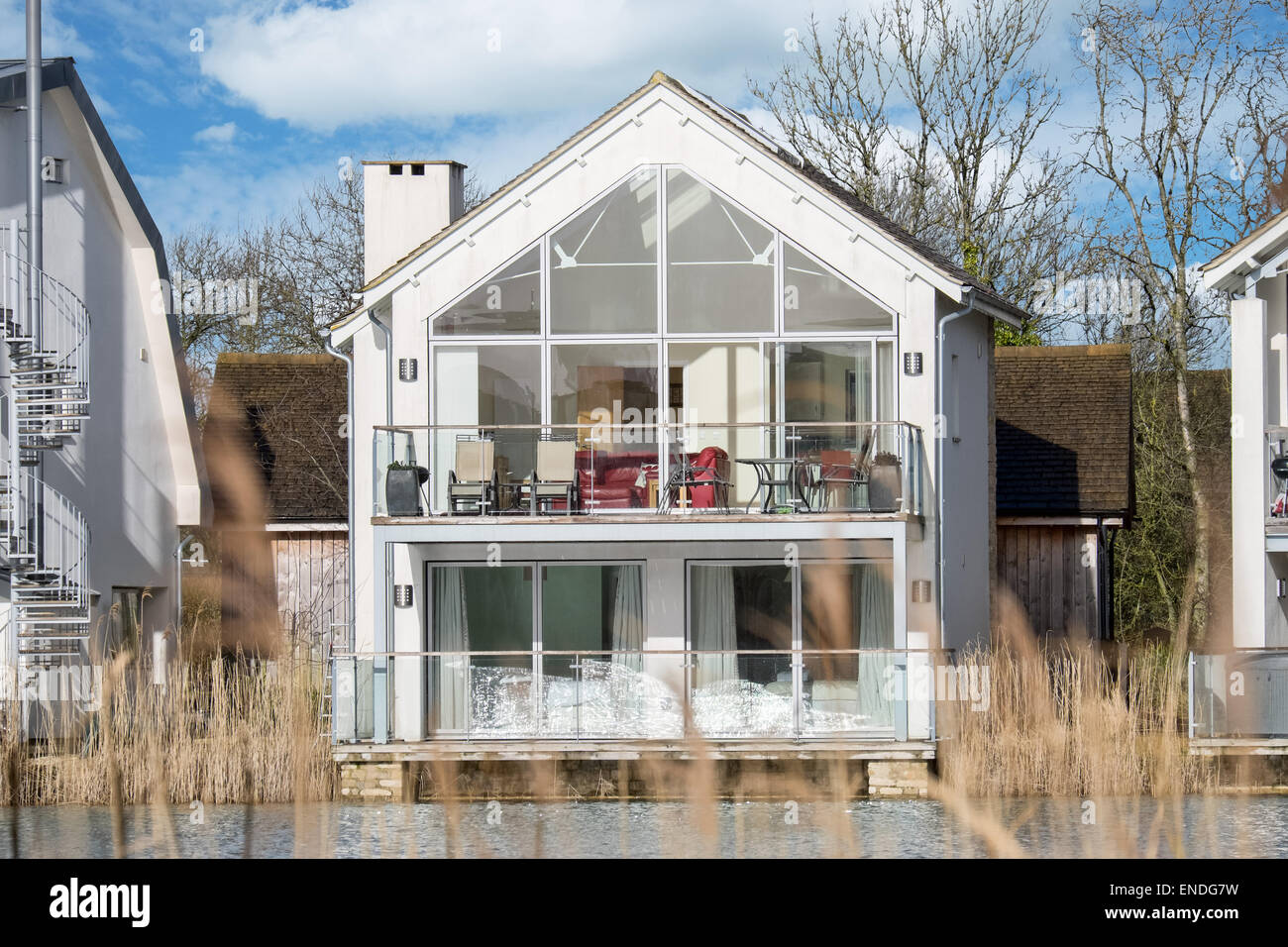 A modern  lakeside holiday home at Lower Mill in the Cotswold water park near Cirencester in Gloucestershire, UK Stock Photo