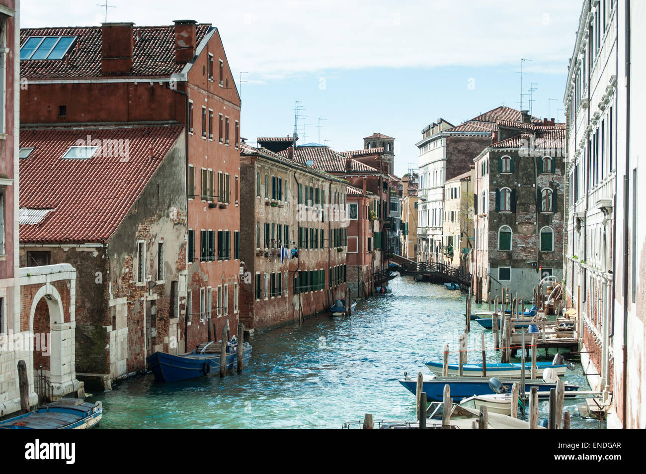 Typical canal with boats as local transportation in Venice, Italy Stock Photo