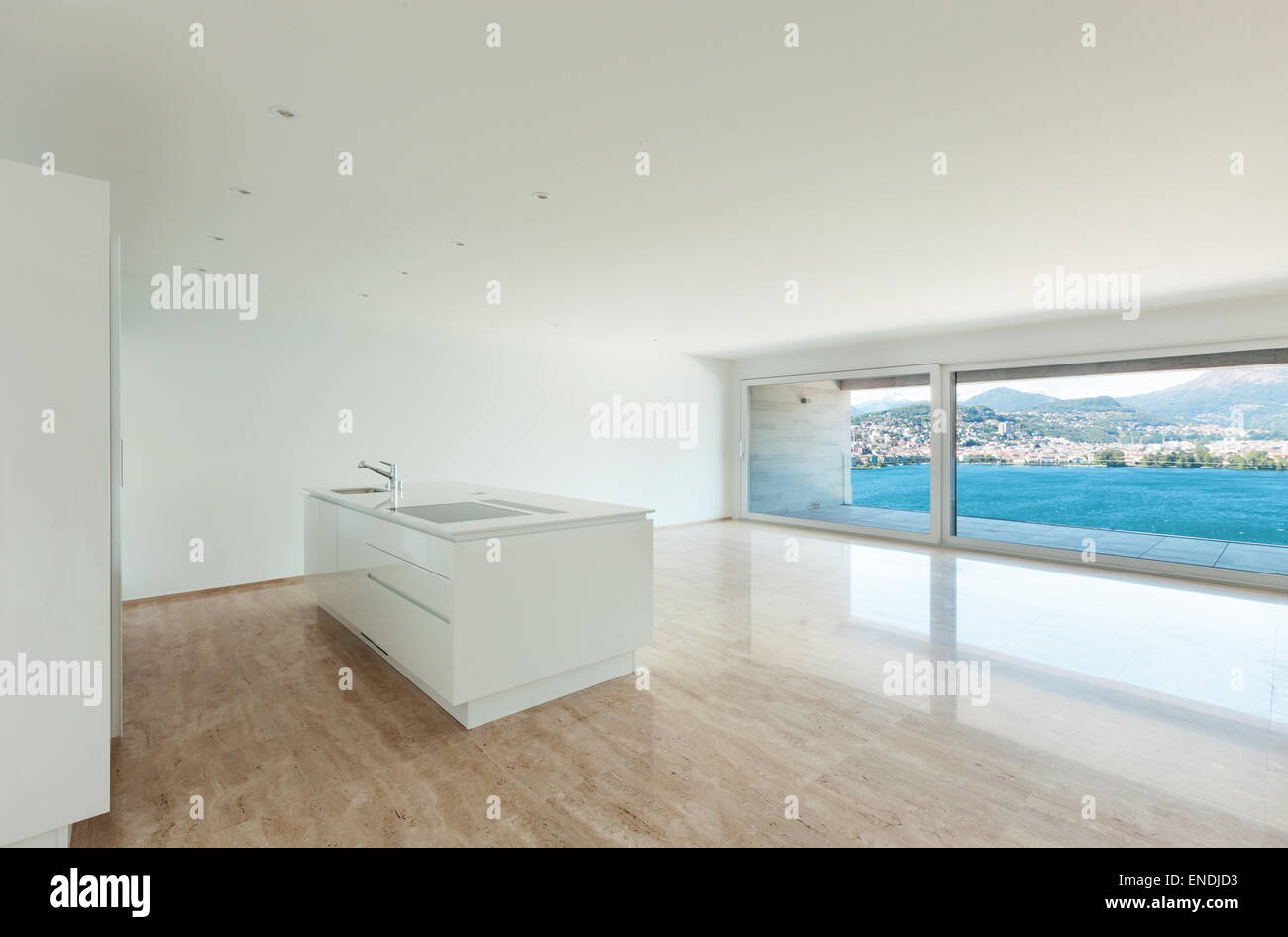 Interior, modern penthouse, empty living room with large windows Stock Photo