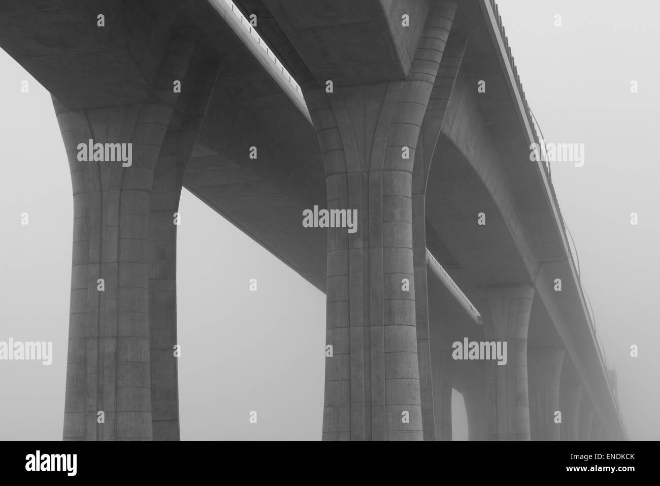 Highway viaduct in the morning mist Stock Photo