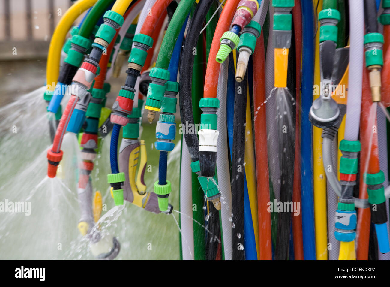 Coloured Hose pipe water fountain Stock Photo Alamy
