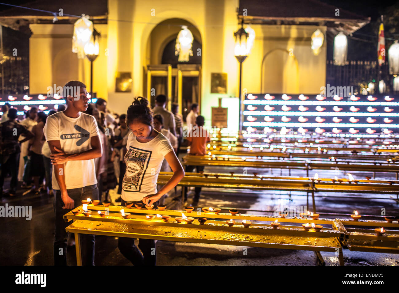 Kandy, Sri Lanka. 3rd May, 2015. Sri Lankans light candles outside