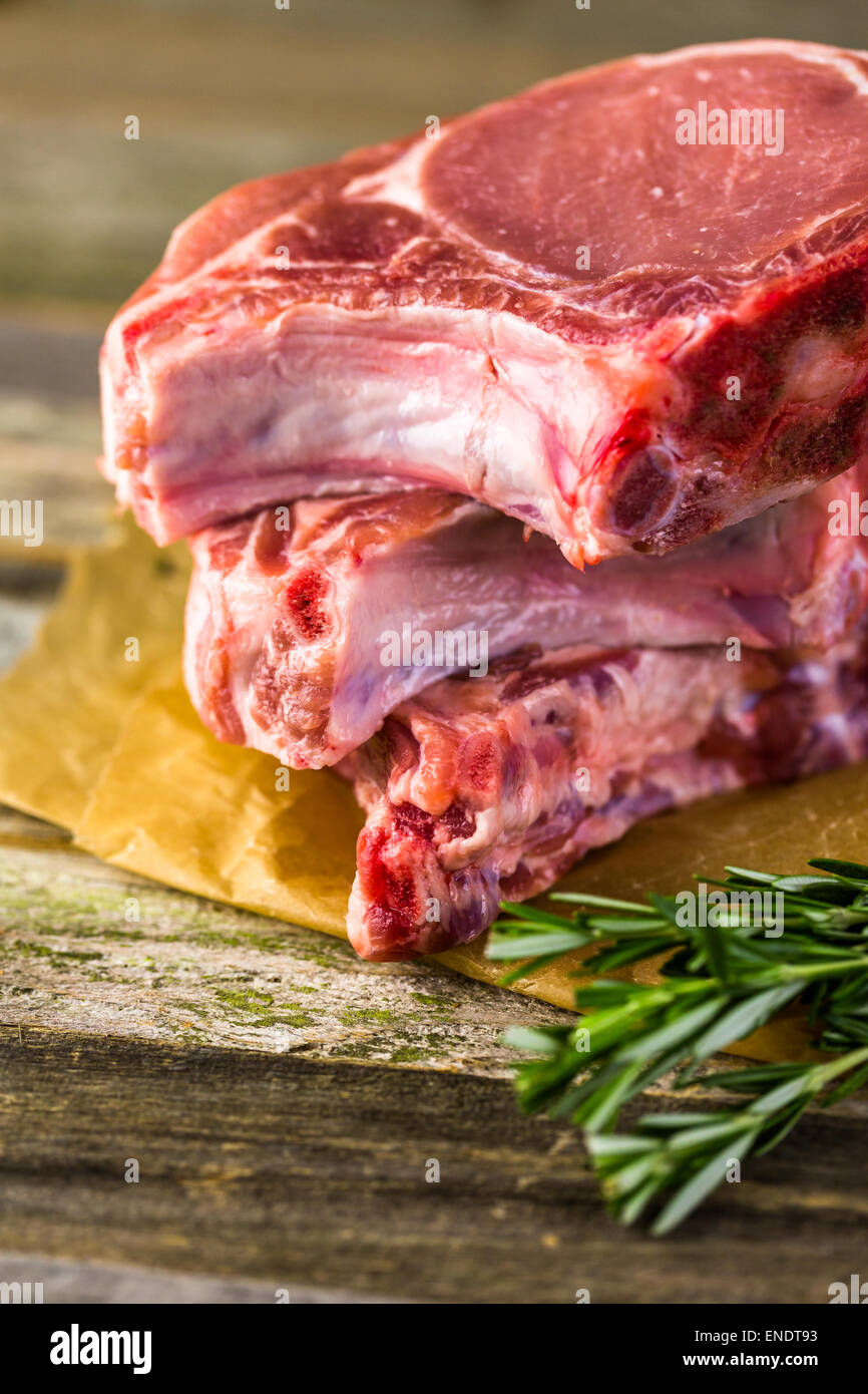 Organic pork lion chops of thick cut with rosemary Stock Photo - Alamy