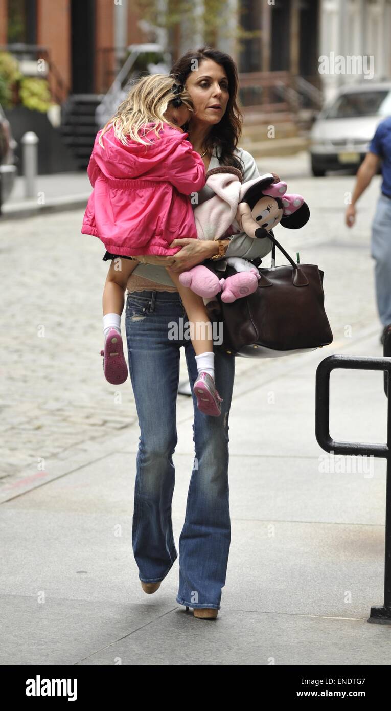 Bethenny Frankel, wearing bell bottom jeans and carrying a Prada bag, picks up daughter Bryn from school Featuring: Bethenny Frankel,Bryn Hoppy Where: New York City, New York, United States When: 29