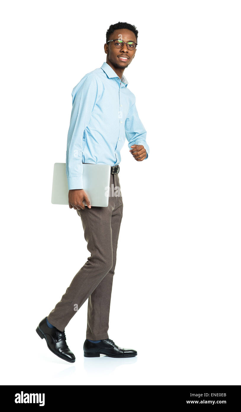 Happy african american college student with laptop standing on white background Stock Photo