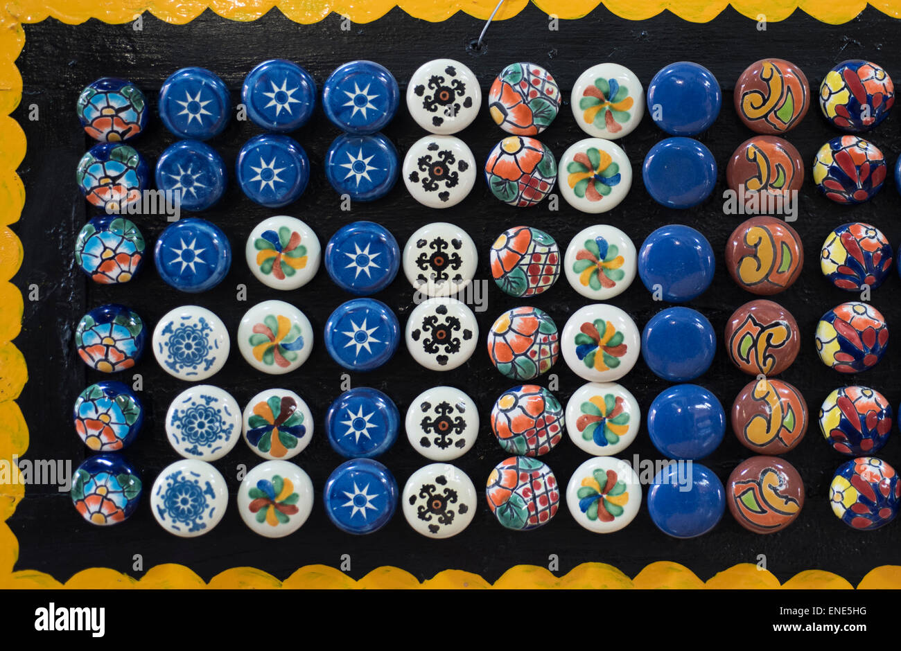 Hand painted ceramic knobs on display in Mexico pottery shop Stock