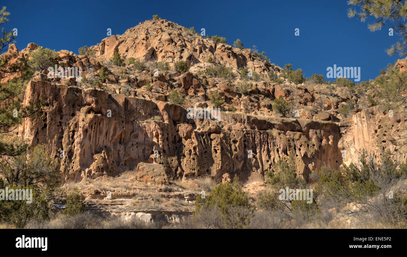 Cliffs of welded volcanic tuff in the Bandelier National Monument, Los Alamos, NM Stock Photo