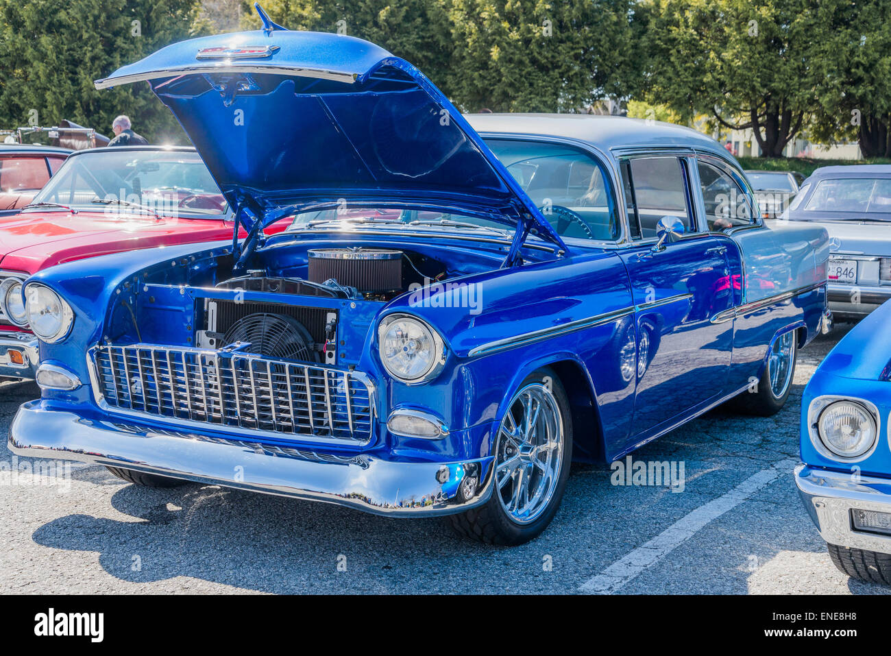 Classic blue Chevrolet automobile with hood up at car show Stock Photo