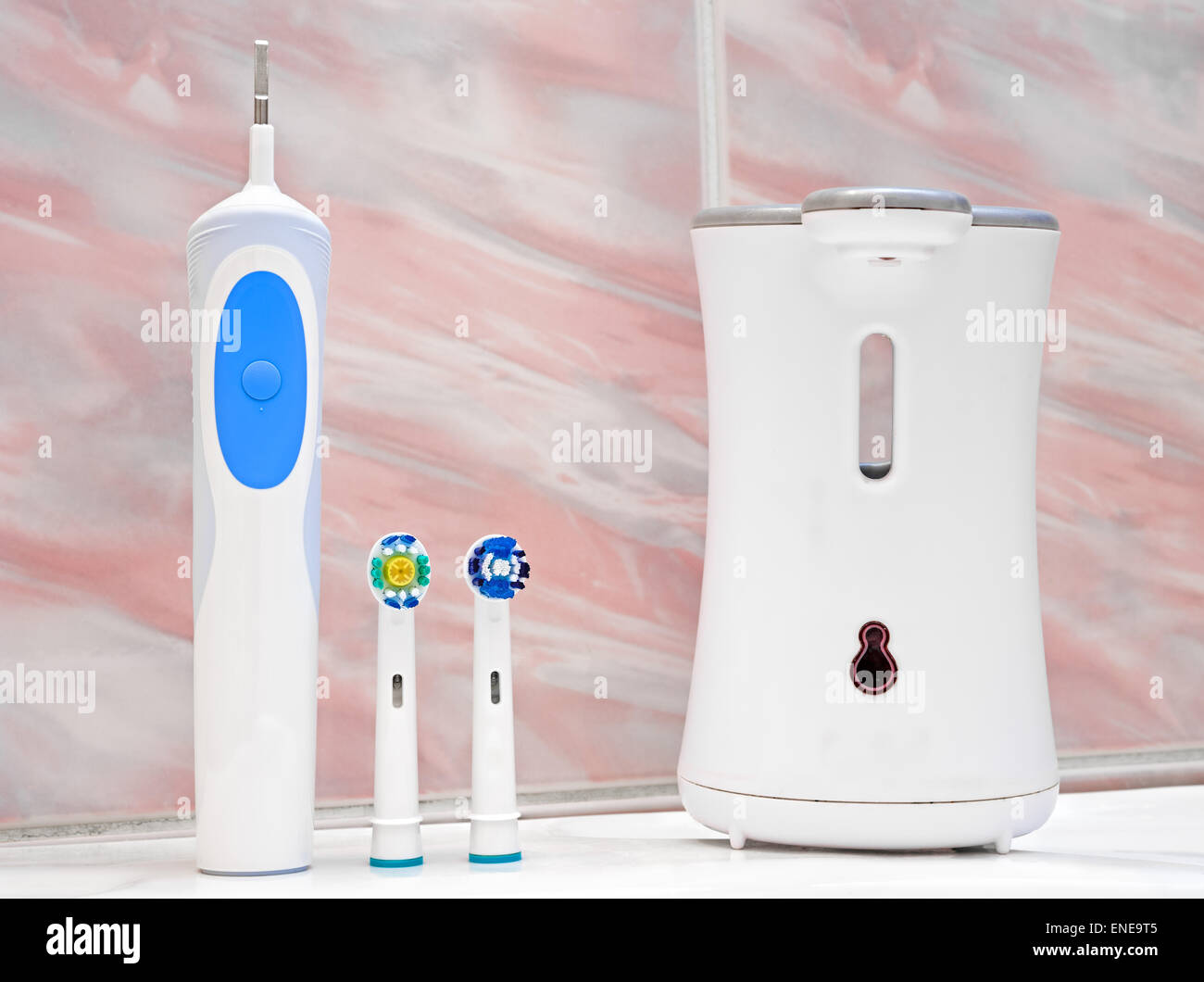 Electric toothbrush in the bathroom Stock Photo Alamy