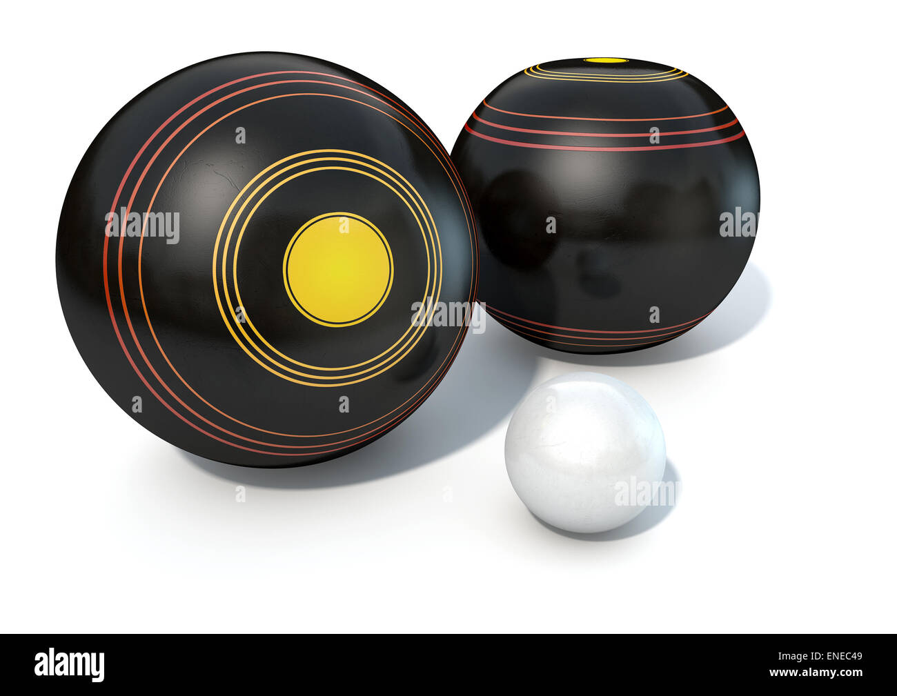 Two wooden lawn bowling balls surrounding a white jack on an isolated white studio background Stock Photo