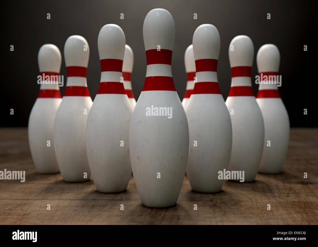 An arrangement of white and red used vintage bowling pins resting on a