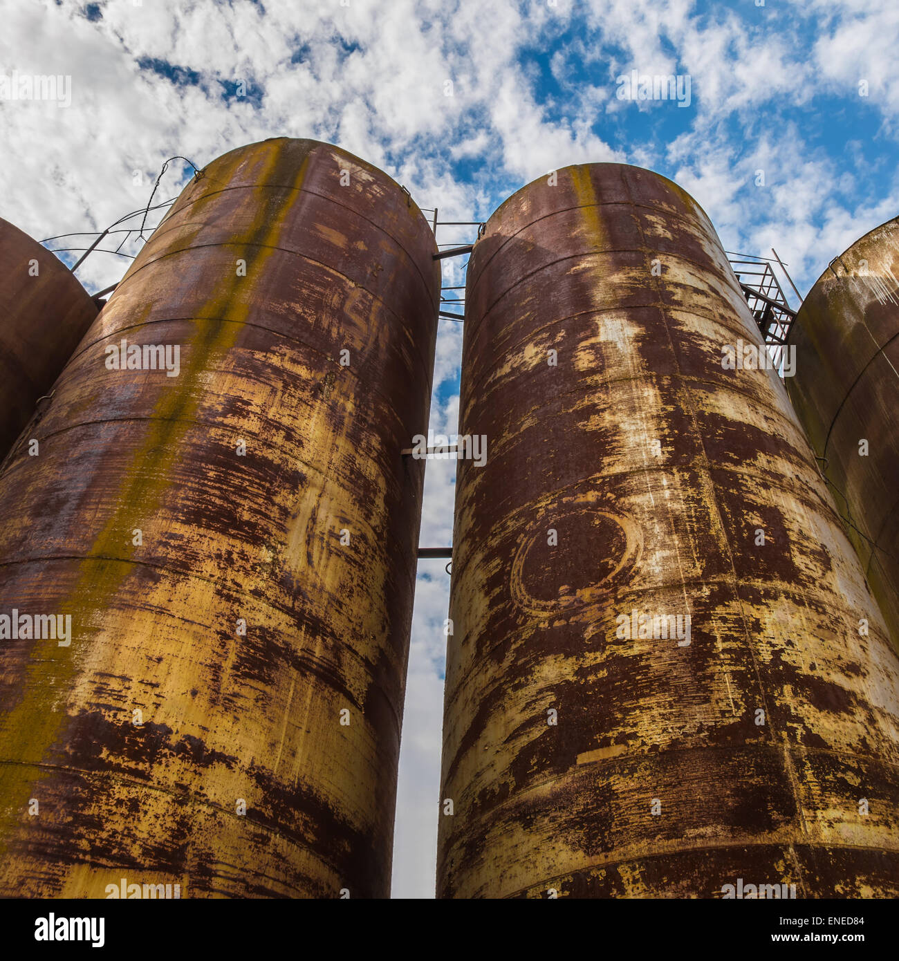 Big old deserted rusty tanks Stock Photo Alamy