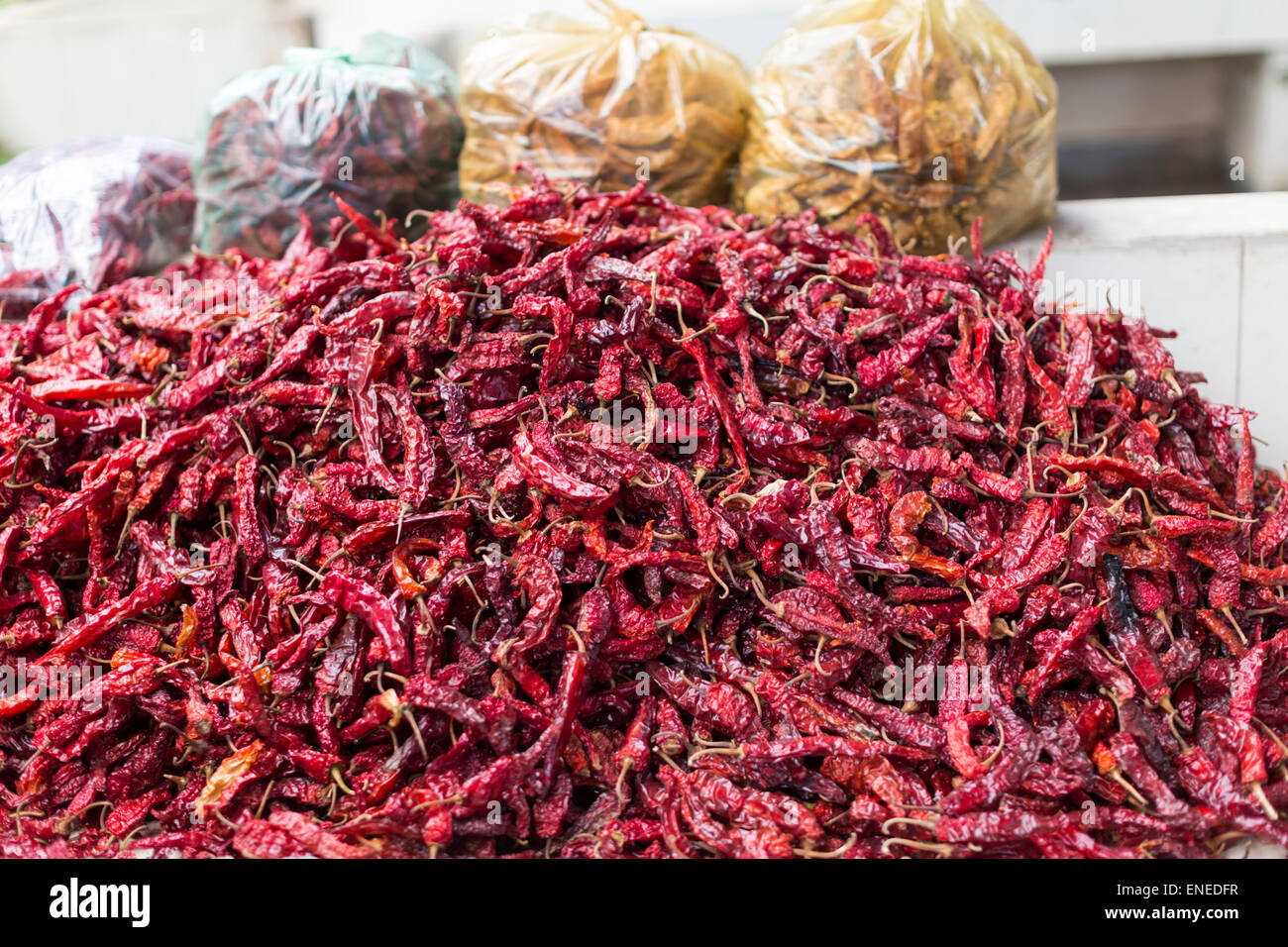 Red chili peppers in market stall in the covered weekend market in Thimphu, Bhutan, Asia Stock Photo