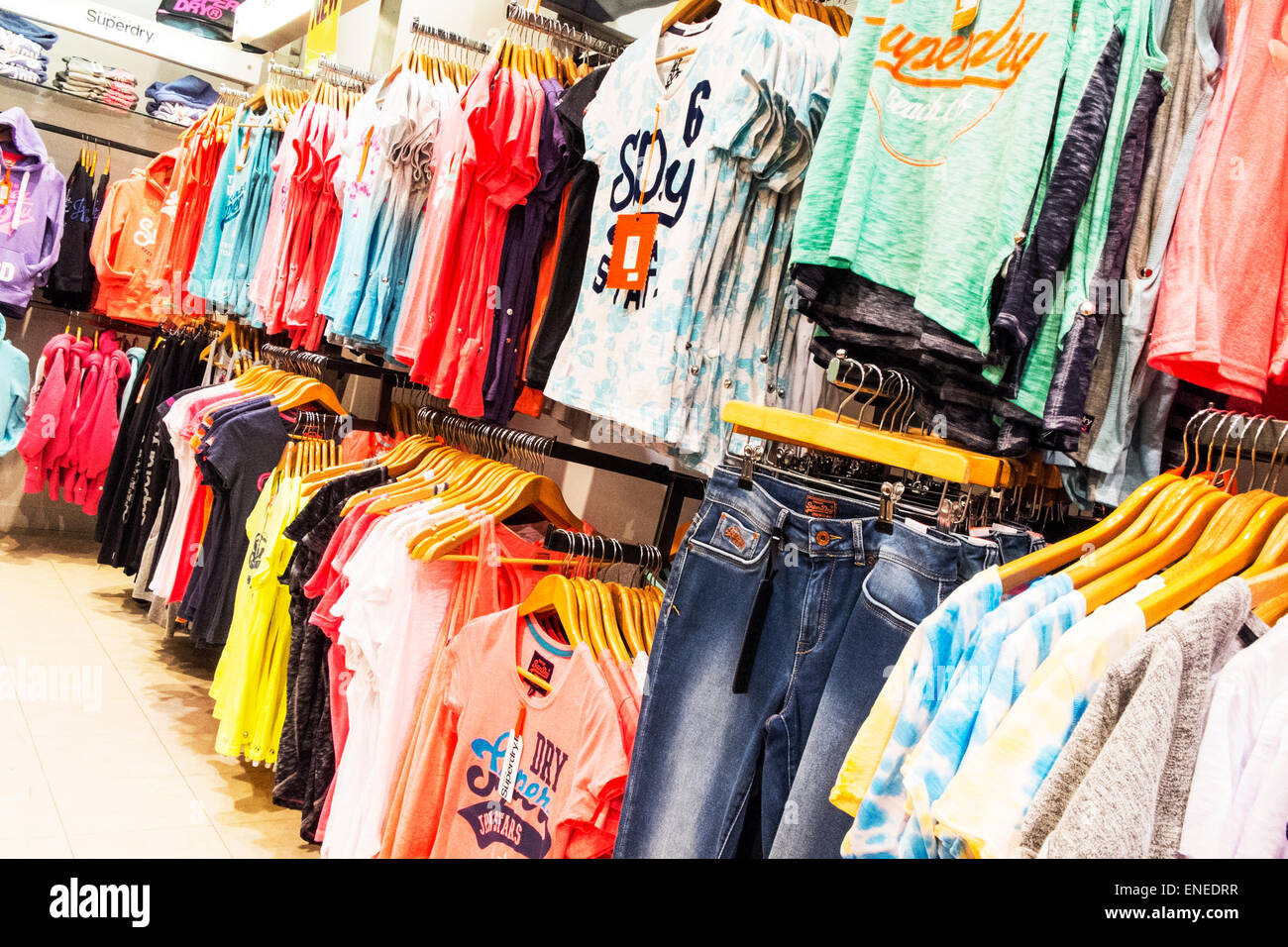 Superdry clothes clothing inside shop store shopping ladies tops t's tshirts Springfields Spalding town Lincolnshire UK England Stock Photo