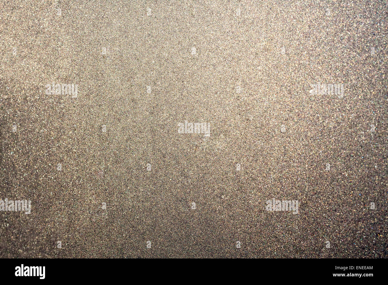 Abstract glittering platinum or brown dust or sand background with blur edges of image Stock Photo