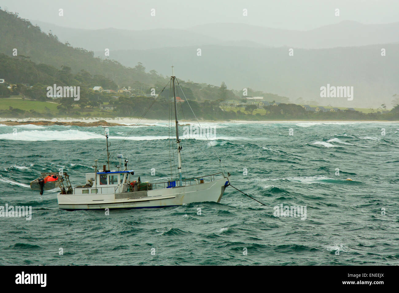 a moored boat facing rough weather Stock Photo Alamy