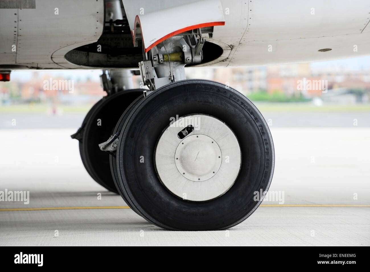 Detail shot with big airplane wheels and landing gear Stock Photo