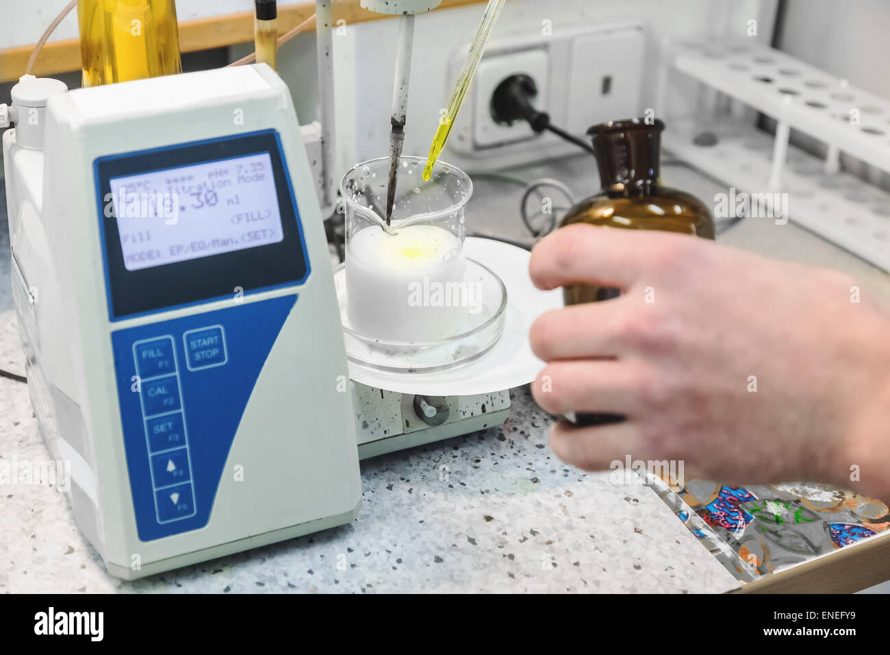 Laborant makes test in research laboratory with electronic measuring equipment on pharmaceutical industry manufacture Stock Photo