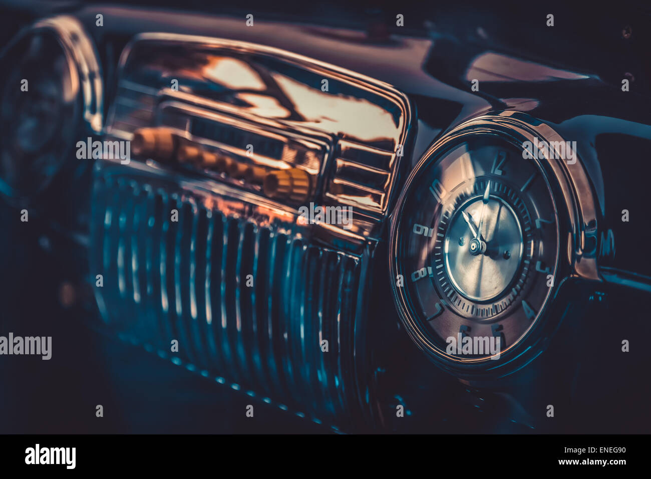Clock on dashboard in retro interior of old automobile. Processed by vintage or retro effect filter Stock Photo