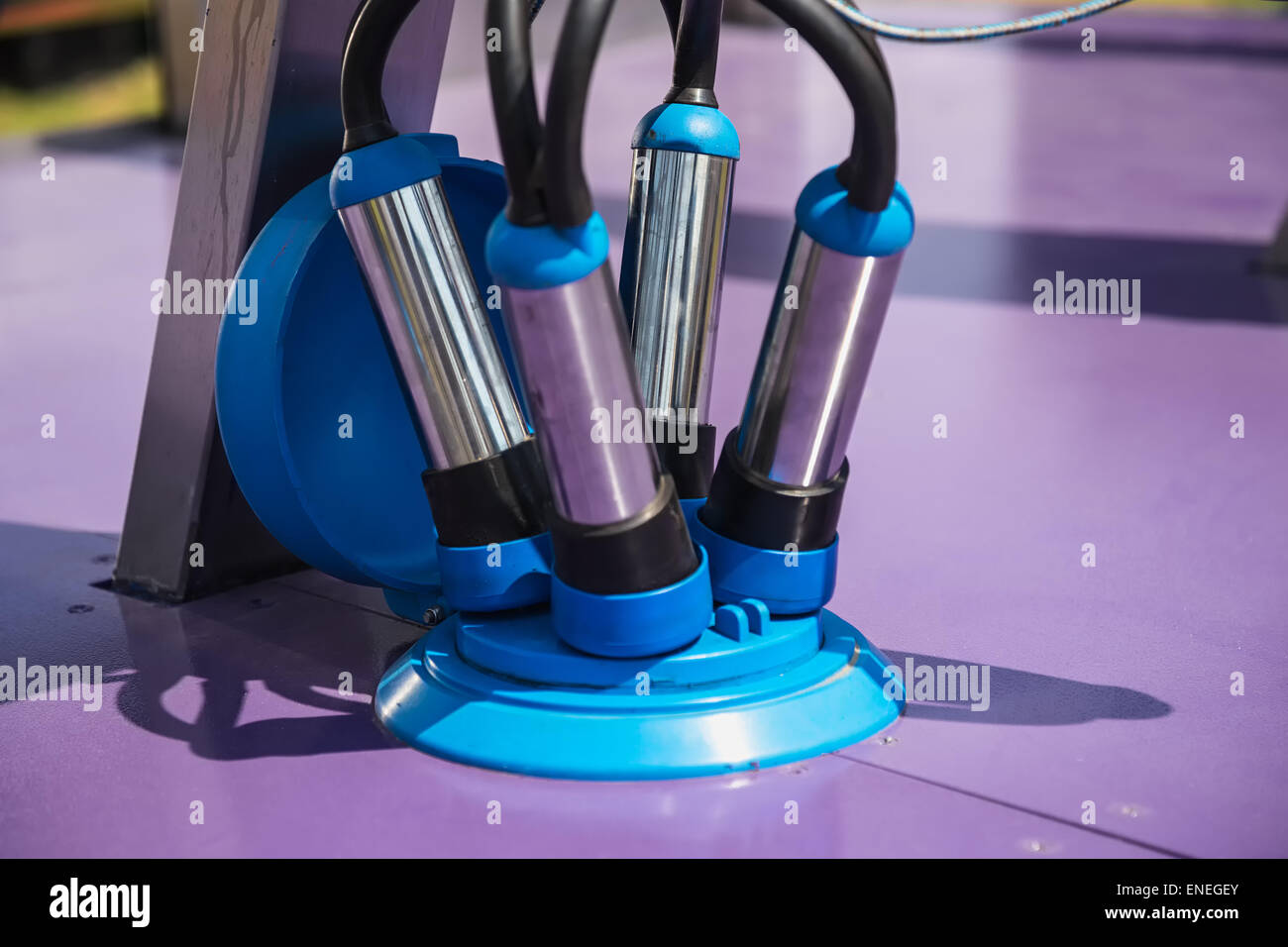 Automated mechanized milking equipment closeup for farmland industry Stock Photo
