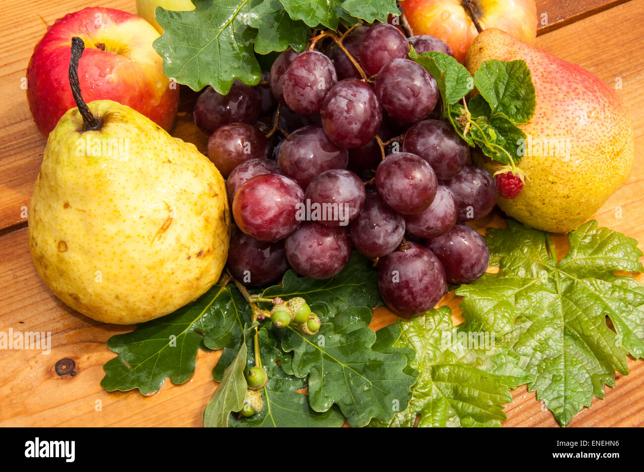 Assorted fruit on the old wooden table top Stock Photo - Alamy