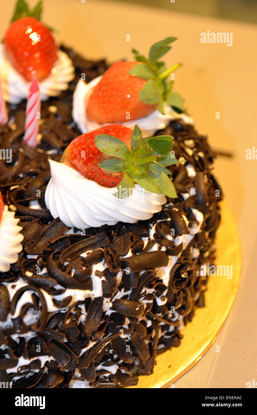 Happy Birthday candles on chocolate cake Stock Photo - Alamy