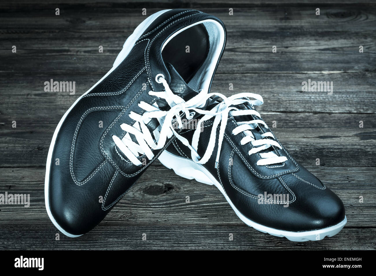 black leather man's shoe on wooden background Stock Photo - Alamy