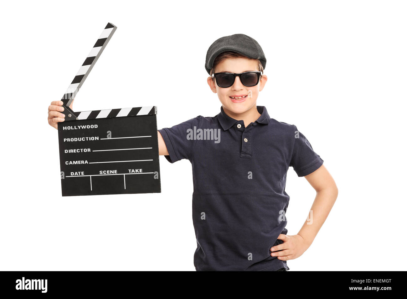 Little boy with a beret and sunglasses holding a movie clapperboard isolated on white background Stock Photo