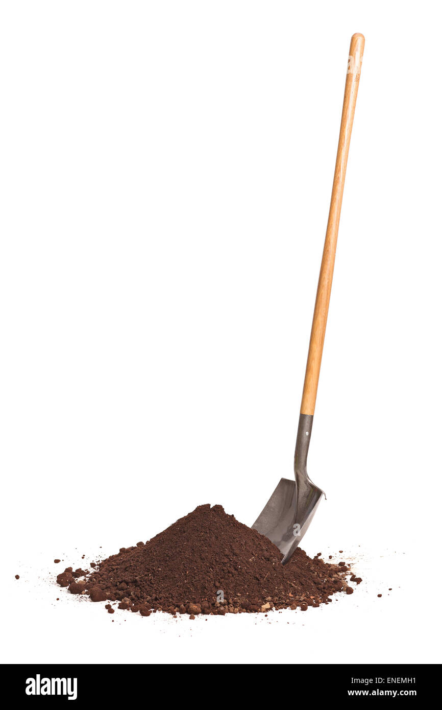 Vertical studio shot of a shovel stuck in a pile of dirt isolated on white background Stock Photo