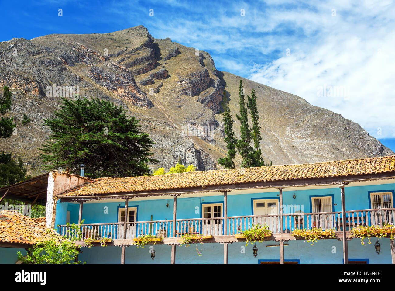Old colonial building with hills rising high above in Tarma, Peru Stock Photo