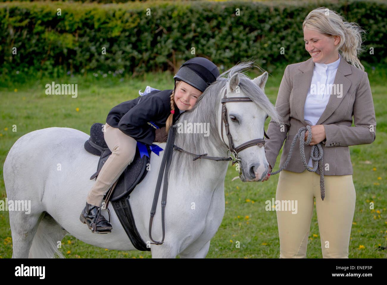 Riders and their horses take part in a local Riding Club Show held at ...