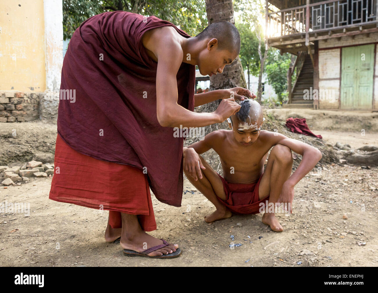 Monk Shaving Head Of Novice Prior To Entering The Monastery,  Mrauk U, Myanmar Stock Photo