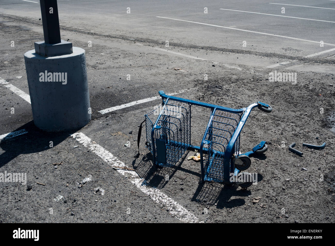 overturned broken shopping cart in parking lot Stock Photo Alamy