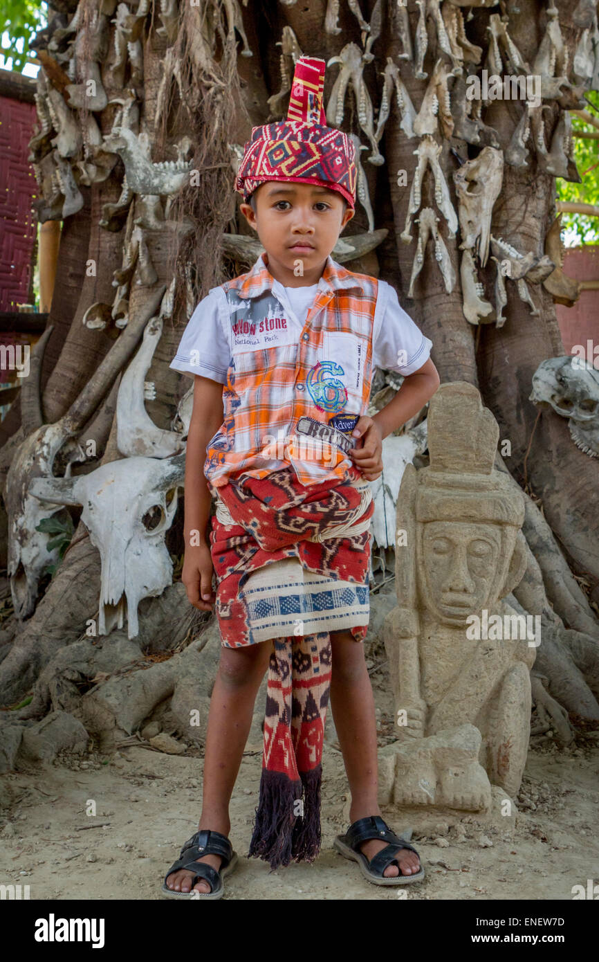 Portrait of a child wearing traditional clothing of Sumba, preparing to attend pre-marriage procession of Umbu Uman and Sarah Hobgen in Prailiu. Stock Photo