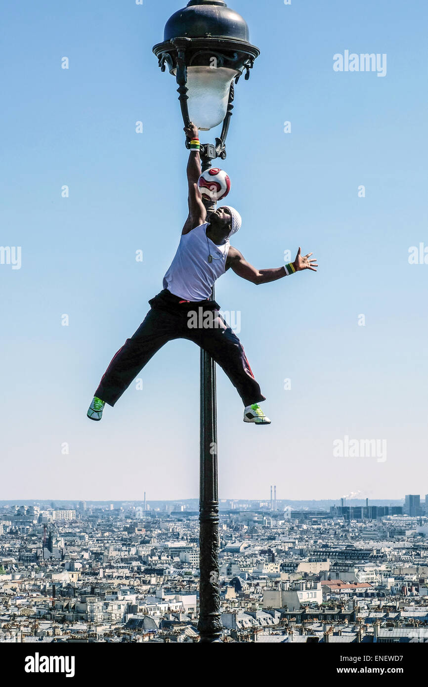 The street artist and football player and freestyler IYA TRAORE in Montmartre, Paris Stock Photo